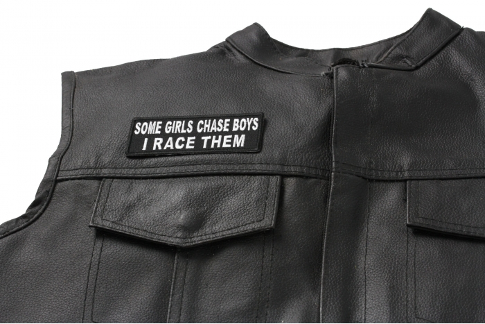 Some Girls Chase Boys I Race Them Patch, Biker Saying Patches shown on leather vest