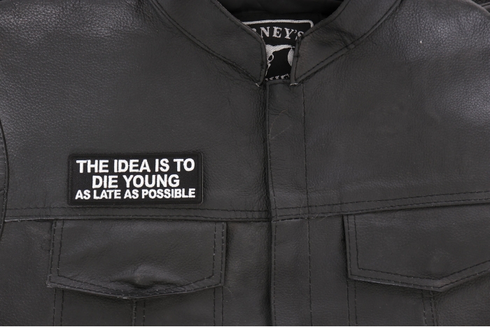 The Idea is to Die Young as Late as Possible Patch, Biker Saying Patches shown on leather vest