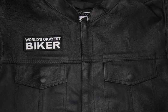 World's Okayest Biker Patch shown on leather vest