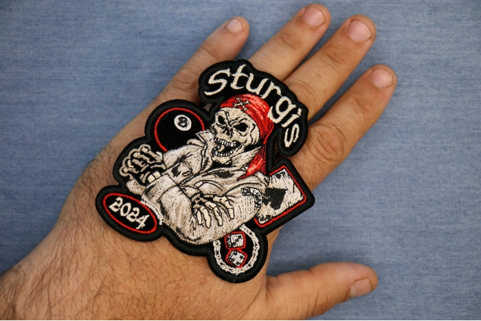 Sturgis 2024 Biker Event Patch shown on hand for size comparison