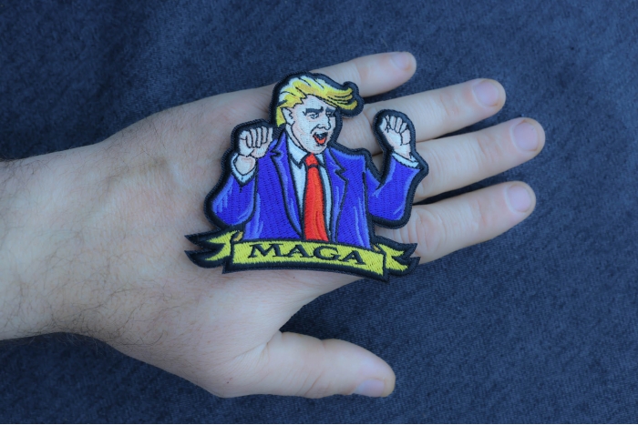 Trump Dancing Patch shown on hand for size comparison