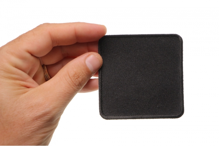 Black 3 Inch Square Blank Patch shown on hand for size comparison