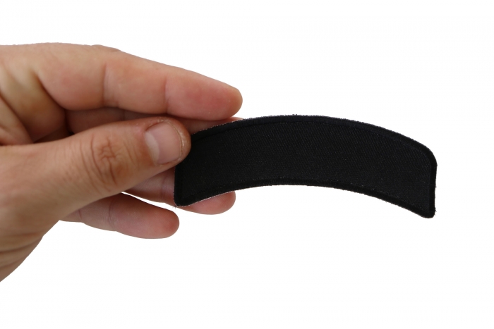 Black 4 Inch Arched Blank Patch Rocker shown on hand for size comparison