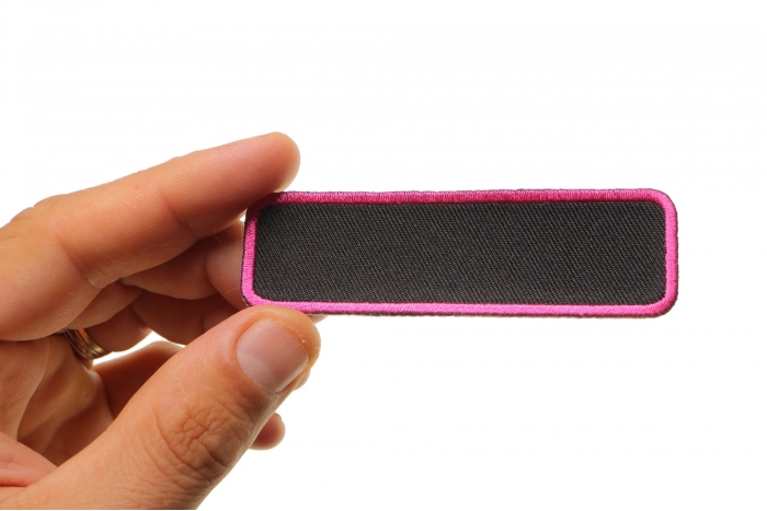 Blank Name Tag Patch Pink Border shown on hand for size comparison