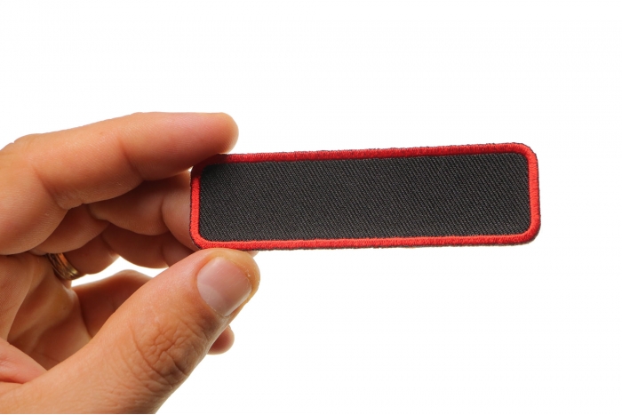 Blank Name Tag Patch Red Border shown on hand for size comparison