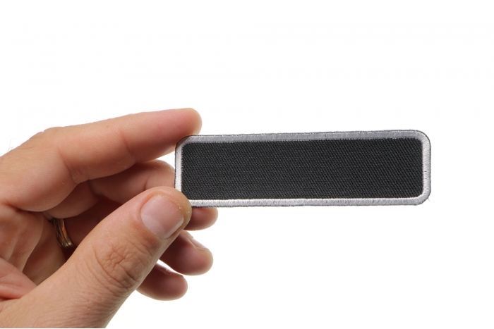 Blank Name Tag Patch White Border shown on hand for size comparison