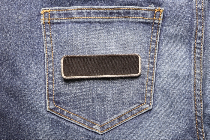 Blank Name Tag Patch Gray Border shown on jeans