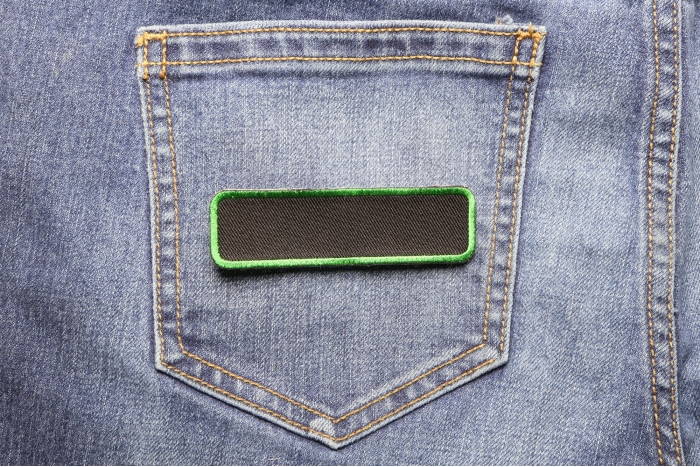 Blank Name Tag Patch Green Border shown on jeans