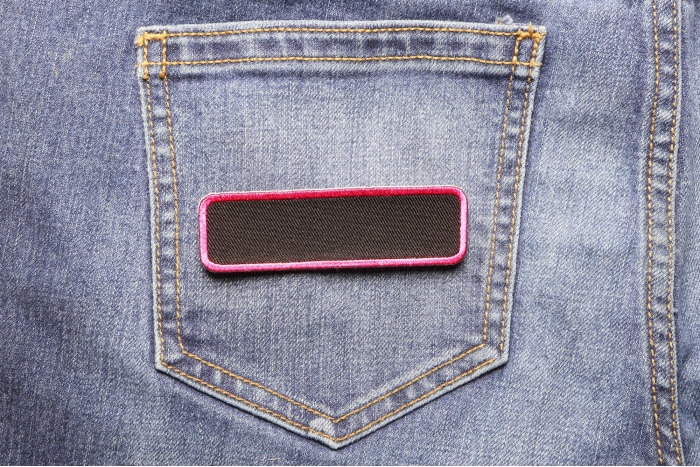 Blank Name Tag Patch Pink Border shown on jeans