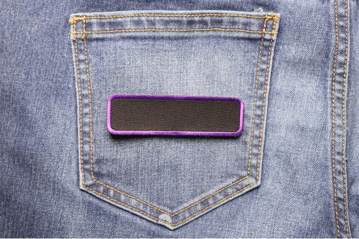 Blank Name Tag Patch Purple Border shown on jeans