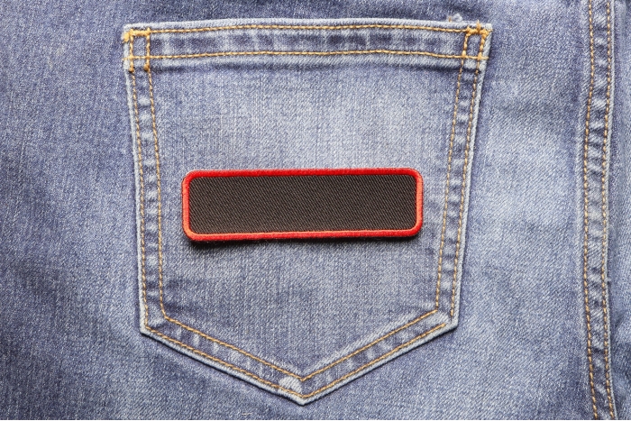 Blank Name Tag Patch Red Border shown on jeans