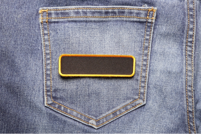 Blank Name Tag Patch Yellow Border shown on jeans