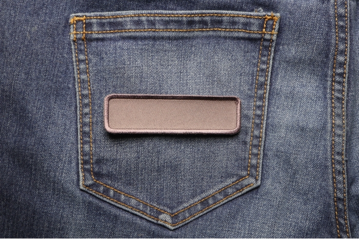 Gray Name Tag Blank Patch shown on jeans