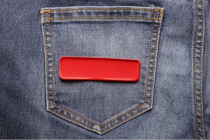 Red Name Tag Blank Patch shown on jeans
