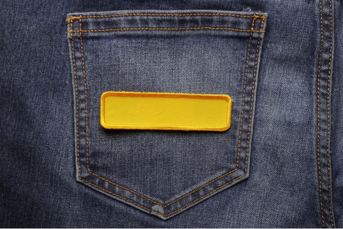 Yellow Name Tag Blank Patch shown on jeans