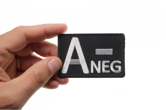 A NEGATIVE Blood Type Patch, Iron on Patch, Embroidered shown on hand for size comparison