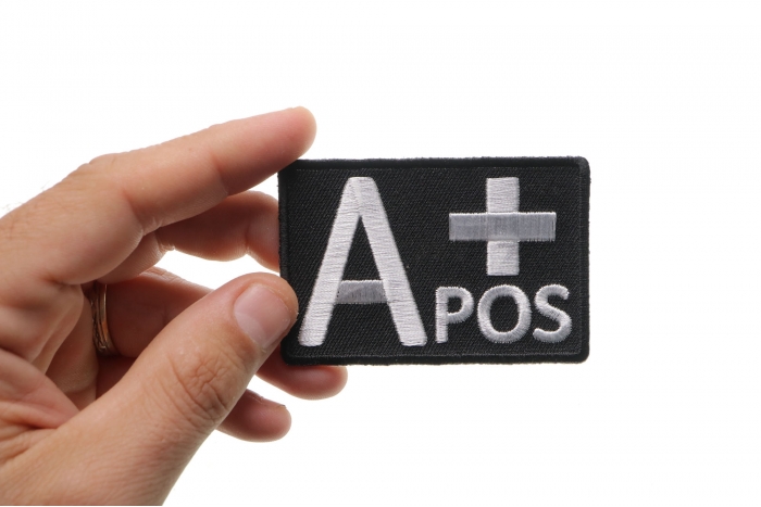 A POSITIVE Blood Type Patch, Iron on Patch, Embroidered shown on hand for size comparison