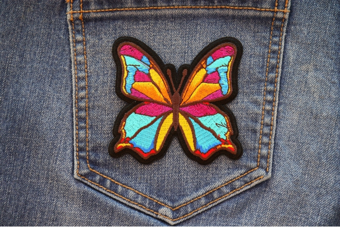 Butterfly Iron on Patch shown on jeans