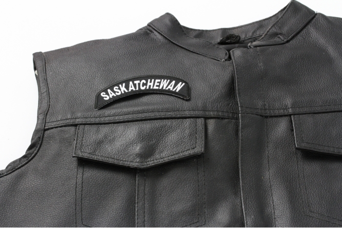 Saskatchewan State Patch - Iron on Patch - 4x1.75 inch shown on leather vest