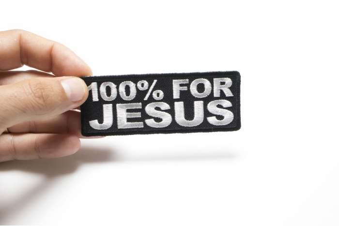 100 Percent For Jesus Christian Patch shown on hand for size comparison