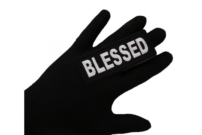 Blessed Iron on Christian Patch shown on hand for size comparison