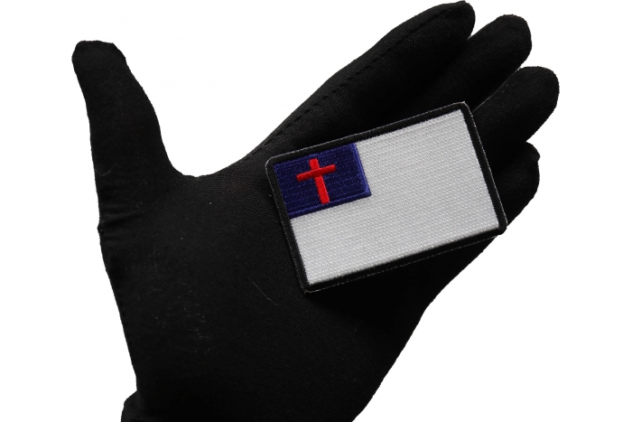 Christian Flag Patch with Black Borders shown on hand for size comparison