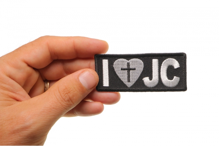 I Love JC Patch shown on hand for size comparison