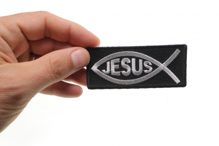 Jesus Fish Patch shown on hand for size comparison