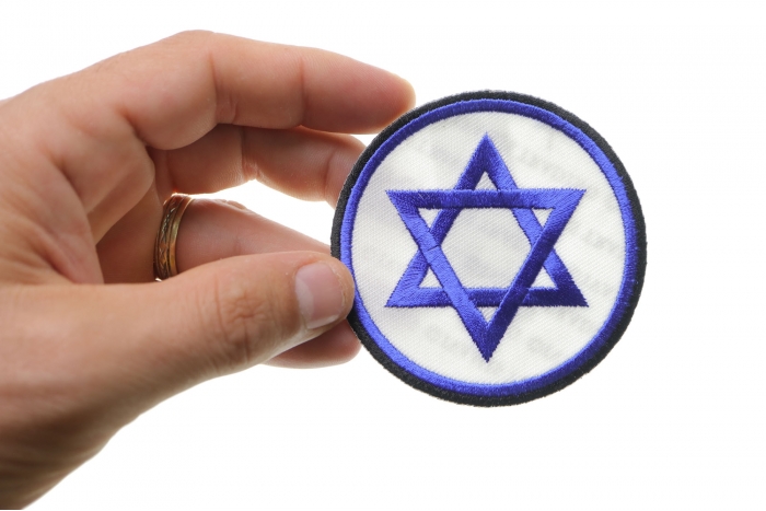 Jewish Star Patch shown on hand for size comparison