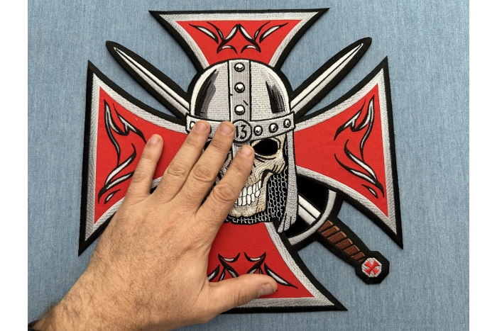 Maltese Cross Skull Knight Patch shown on hand for size comparison