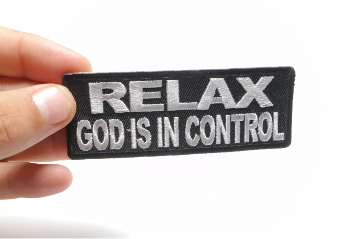 Relax God Is In Control Patch shown on hand for size comparison