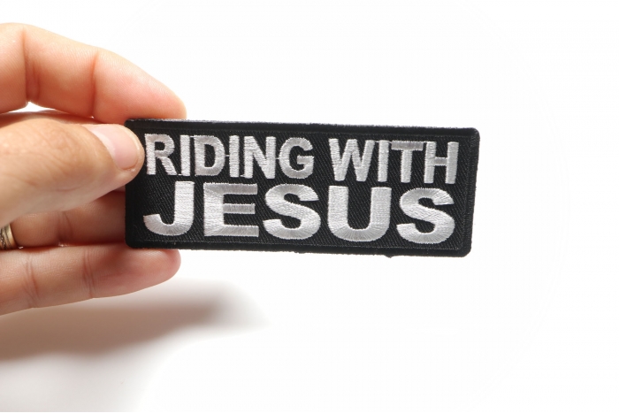 Riding With Jesus Christian Patch shown on hand for size comparison