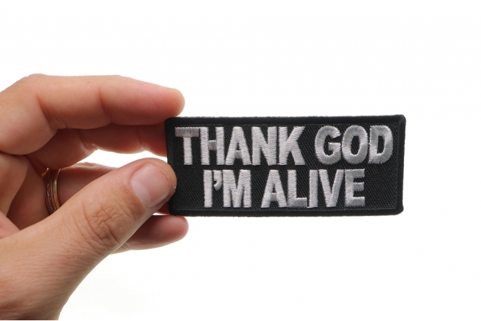Thank God I'm Alive Christian Patch shown on hand for size comparison