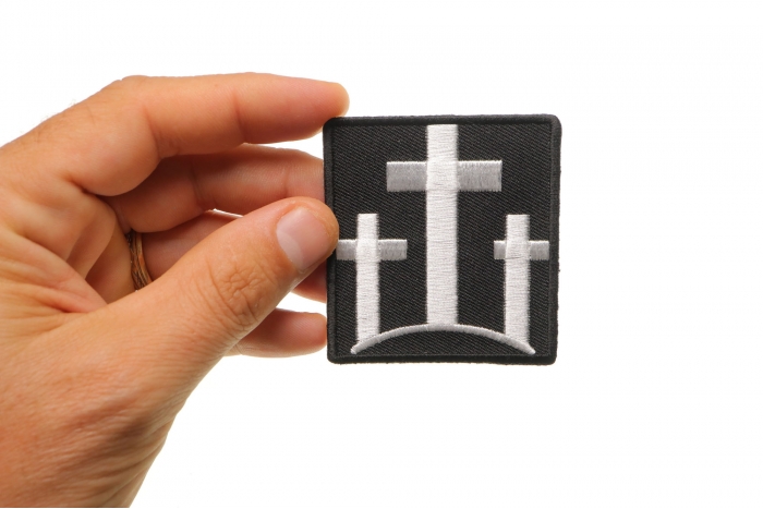Three Crosses Christian Patch shown on hand for size comparison