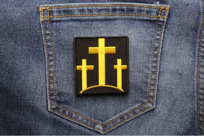 Black and Yellow Three Crosses Christian Patch shown on jeans