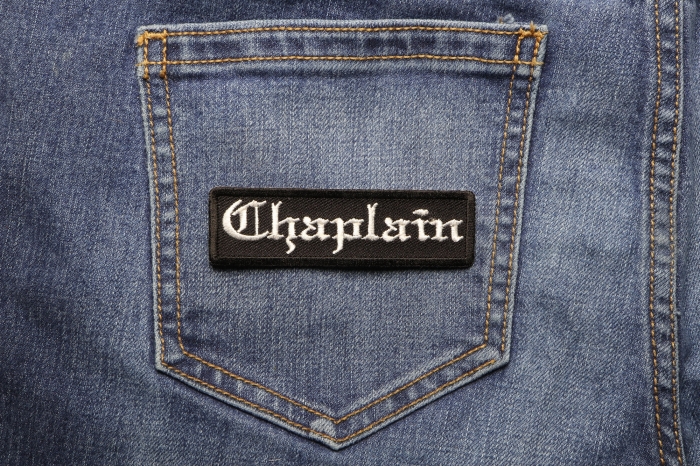 Chaplain Patch In Old English shown on jeans