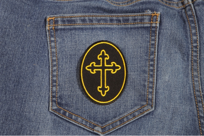 Christian Cross Oval Patch shown on jeans