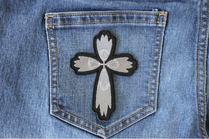 Christian Cross Silver Patch shown on jeans