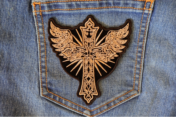Christian Cross with Wings Patch shown on jeans