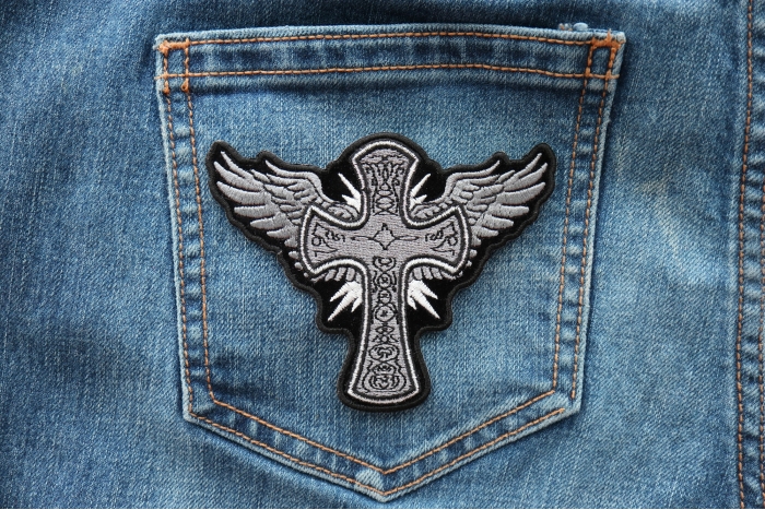 Cross with Wings Iron on Christian Patch shown on jeans