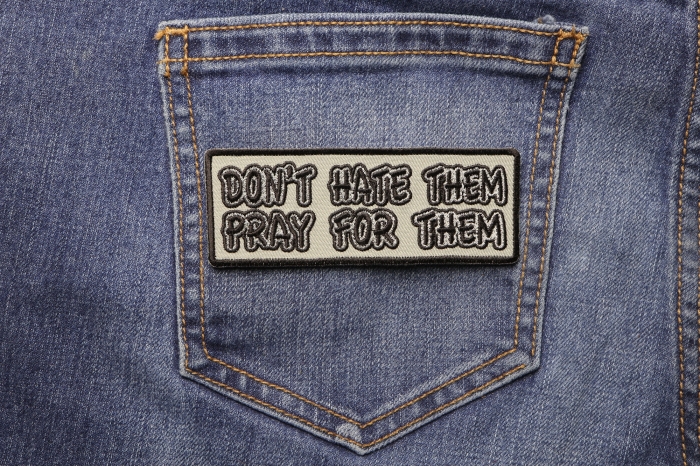 Don't Hate Them Pray For Them Patch shown on jeans
