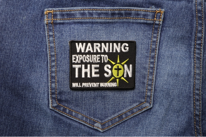 Exposure To The Son Christian Patch shown on jeans