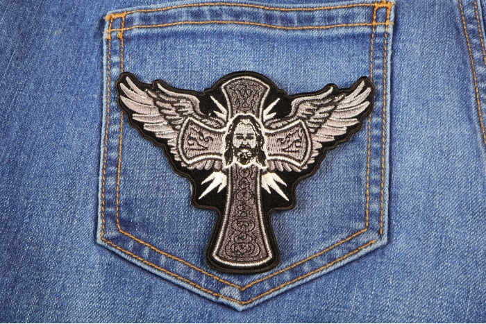 Jesus Cross and Wings Iron on Patch shown on jeans