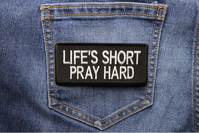 Life's Short Pray Hard Patch shown on jeans