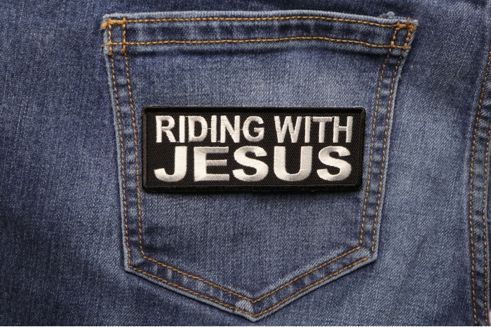 Riding With Jesus Christian Patch shown on jeans