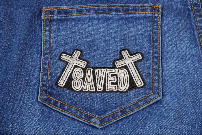 SAVED Christian Patch shown on jeans