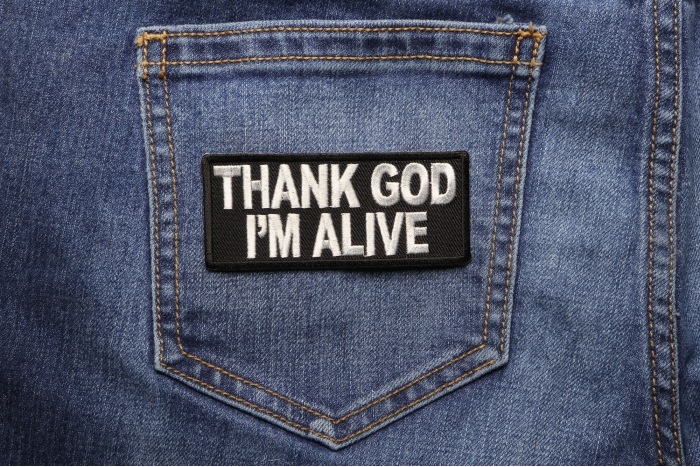Thank God I'm Alive Christian Patch shown on jeans