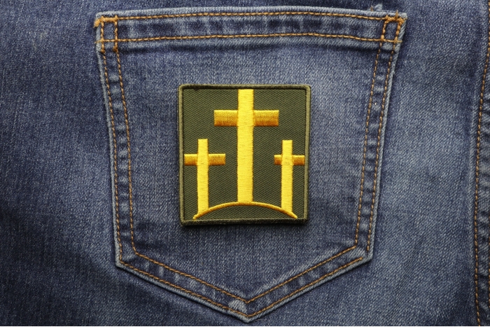 Three Crosses Patch shown on jeans