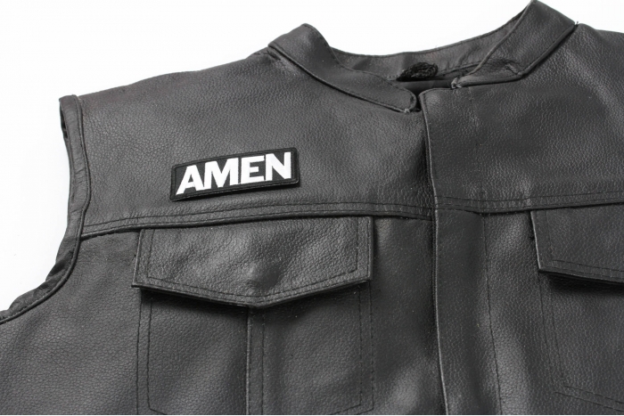 Amen Patch - 3x1.5 inch. Embroidered Iron on Patch shown on leather vest