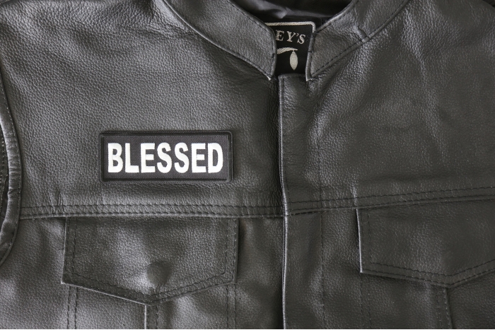 Blessed Iron on Patch - 4x1.5 inch - Embroidered Iron on Patch shown on leather vest